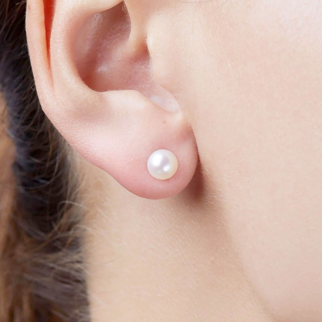 button pearl earrings